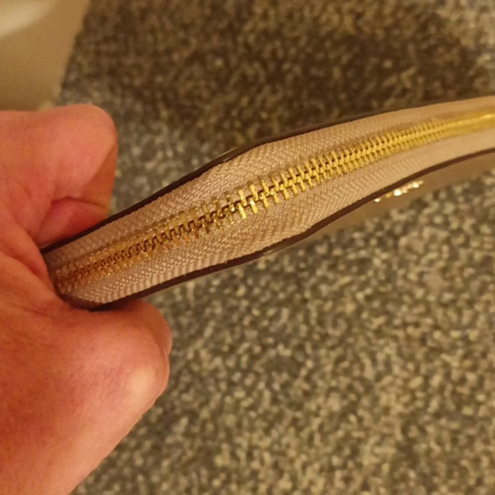 Coach gold pebbled leather accordion wallet